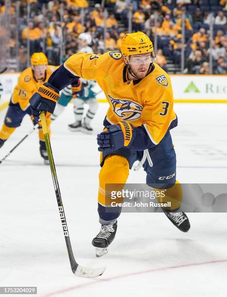 Jeremy Lauzon of the Nashville Predators skates against the San Jose Sharks during an NHL game at Bridgestone Arena on October 21, 2023 in Nashville,...
