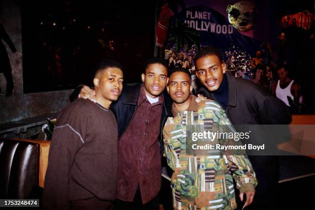 Actors Larron, Larenz and Lahmard Tate poses for photos with comedian Bill Bellamy at Planet Hollywood in Chicago, Illinois in March 1997.