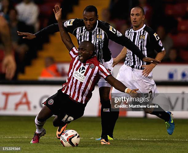 Febian Brandy of Sheffield United and Yoann Arquin of Notts County challenge for the ball during the Sky Bet League One match between Sheffield...