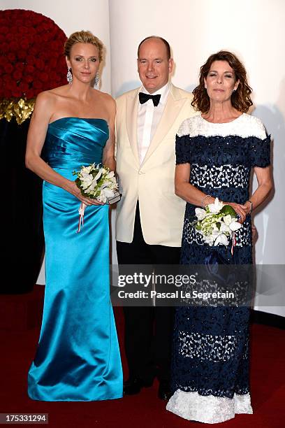 Princess Charlene of Monaco, Prince Albert II of Monaco and Princess Caroline of Hanover attend the 65th Monaco Red Cross Ball Gala at Sporting...