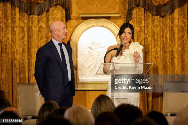 Jeff Bezos and Lauren Sánchez speak onstage during7 the IWMF Courage in Journalism Awards on October 23, 2023 in Washington, DC.