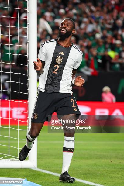 Antonio Rüdiger of Germany reacts after scoring a goal against Guillermo Ochoa of Mexico during the first half of the international friendly at...