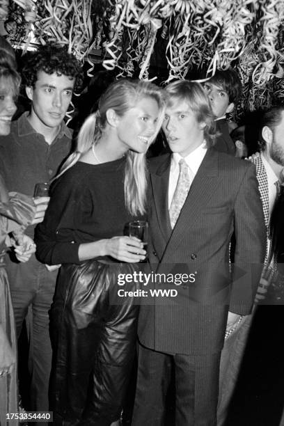 Olivier Chandon de Brailles, Christie Brinkley, and Christopher Atkins attend a party, celebrating the 16th birthday of Calvin Klein's daughter, at...