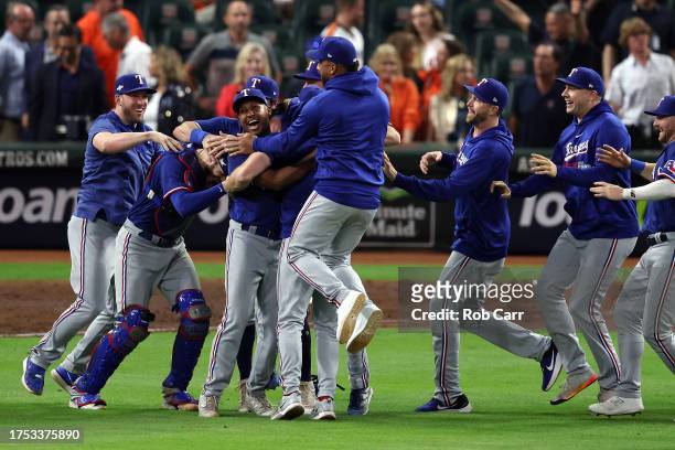 Jose Leclerc of the Texas Rangers celebrates with his teammates after defeating the Houston Astros in Game Seven to win the American League...