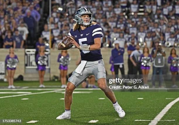 Quarterback Avery Johnson of the Kansas State Wildcats runs throws a pass against the TCU Horned Frogs in the first half at Bill Snyder Family...