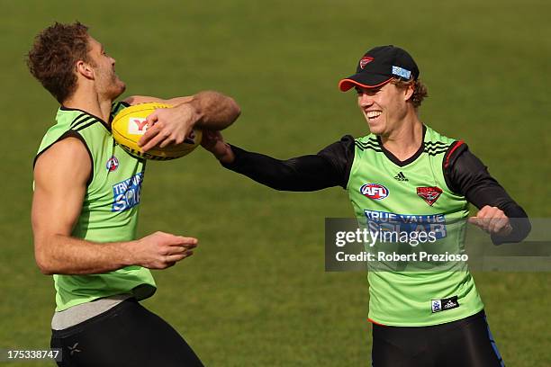 David Hille breaks a tackle during an Essendon Bombers AFL training session at Windy Hill on August 3, 2013 in Melbourne, Australia.