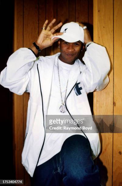 Singer Usher poses for photos after his performance at the Rosemont Horizon in Rosemont, Illinois in July 1998.