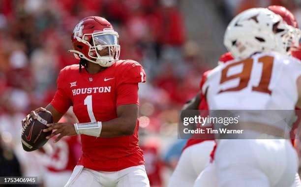 Donovan Smith of the Houston Cougars looks to pass in the first quarter against the Texas Longhorns at TDECU Stadium on October 21, 2023 in Houston,...