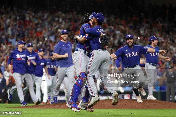 Jose Leclerc of the Texas Rangers celebrates with Jonah Heim after defeating the Houston Astros in Game Seven to win the American League Championship...