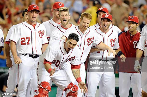 The Washington Nationals celebrate at homeplate after a 2-1 victory against the New York Mets at Nationals Park on July 26, 2013 in Washington, DC.