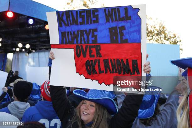 Kansas Jayhawks fan holds a sign that says Kansas Will Always Be Over Oklahoma before a Big 12 football game between the Oklahoma Sooners and Kansas...