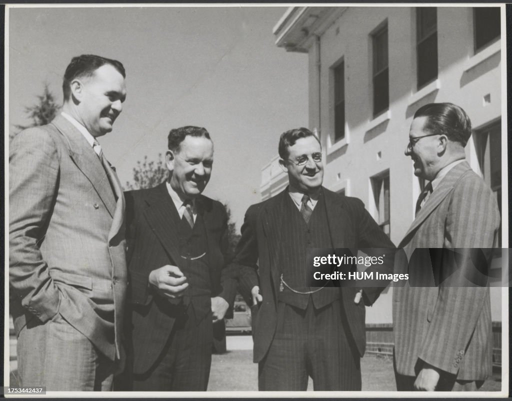 Australian Labor Party (ALP) politicians Bill Riordan, Sol Rosevear, Arthur Calwell, and Eddie Ward outside Parliament House, Canberra ca. 1945