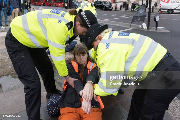 Police officers arrest environmental activists from Just Stop Oil in Parliament Square as they begin their latest round of protest actions against...