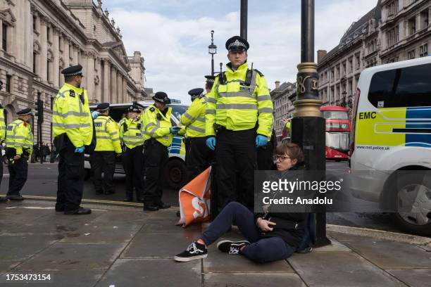 Police officers arrest environmental activists from Just Stop Oil in Parliament Square as they begin their latest round of protest actions against...
