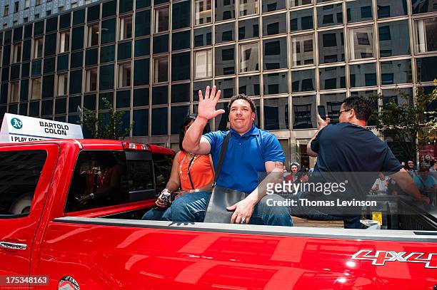 American League All-Star Bartolo Colon of the Oakland A's waves to fans during the 2013 All-Star Red Carpet Show presented by Chevrolet on July 16,...