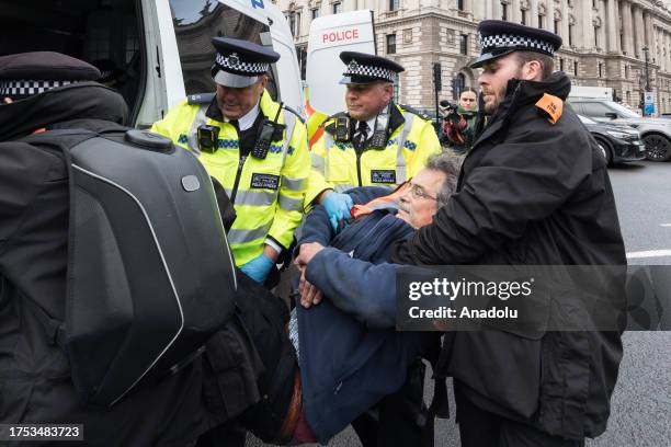 Police officers arrest environmental activists from Just Stop Oil in Parliament Square as they begin their latest round of protest actions against...