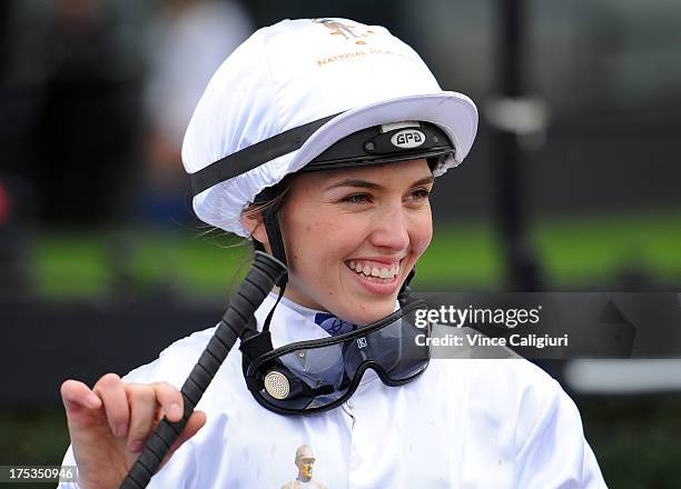 Kayla Nisbet smiles after riding Gregers to win the Aquanas Foods BM78 Handicap during Melbourne racing at Moonee Valley Racecourse on August 3, 2013...