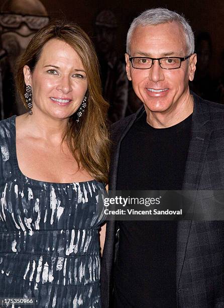 Dr. Drew Pinsky and wife Susan Pinsky attend the launch of Loni Love's new book "Love Him or Leave Him" at Hollywood Improv on August 2, 2013 in...