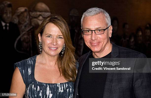 Dr. Drew Pinsky and wife Susan Pinsky attend the launch of Loni Love's new book "Love Him or Leave Him" at Hollywood Improv on August 2, 2013 in...