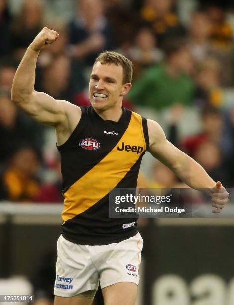 Nathan Foley of the Tigers celebrates a goal during the round 19 AFL match between the Hawthorn Hawks and the Richmond Tigers at Melbourne Cricket...