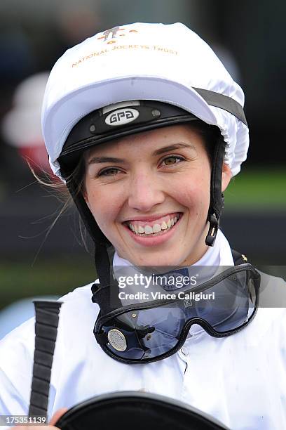 Kayla Nisbet smiles after riding Gregers to win the Aquanas Foods BM78 Handicap during Melbourne racing at Moonee Valley Racecourse on August 3, 2013...