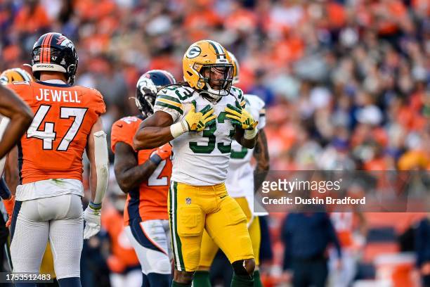 Running back Aaron Jones of the Green Bay Packers celebrates after a fourth quarter carry for a first down against the Denver Broncos at Empower...