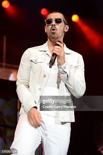 Joe Jonas of The Jonas Brothers performs at Cruzan Amphitheatre on August 2, 2013 in West Palm Beach, Florida.