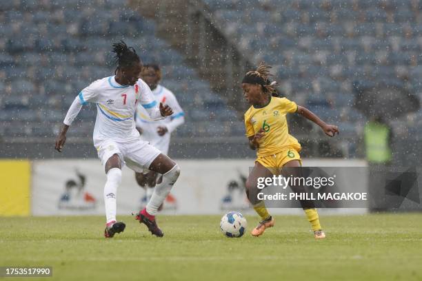 South Africa's forward Noxolo Cesane is tackled by Democratic Republic of Congo's Naomi Kabakaba during the 2024 Olympic Qualifier second leg match...