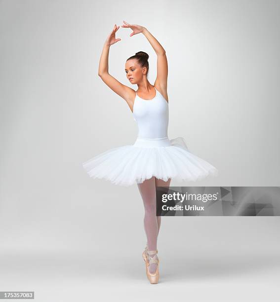 young ballet dancer wearing tutu against white - copyspace - tutu stock pictures, royalty-free photos & images