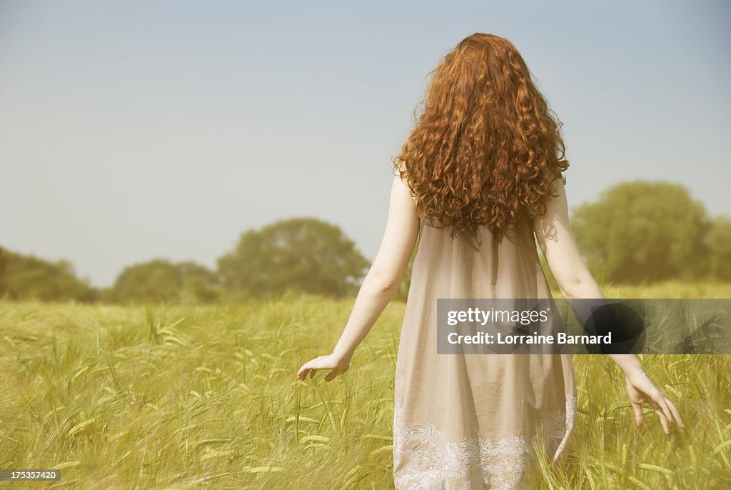 Girl in a cornfield with long hair