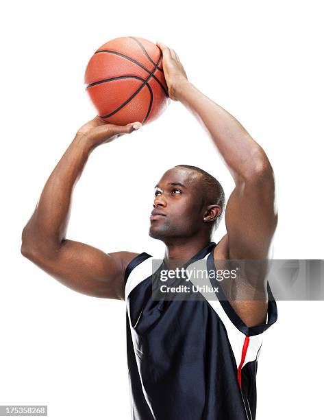 confident basketball player taking free throw against white - throwing stock pictures, royalty-free photos & images