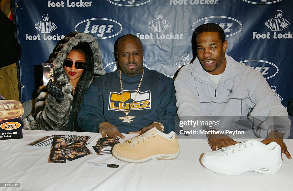 Hip hop artists Lil' Kim, Funkmaster Flex and Busta Rhymes attend