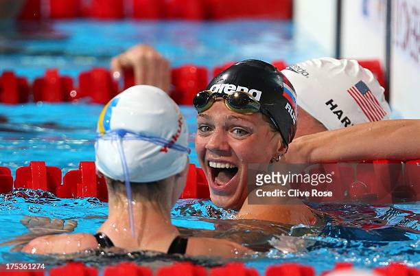Yuliya Yefimova of Russia celebrates her new world record with Mariia Liver of the Ukraine after the Swimming Women's 50m Breaststroke preliminaries...