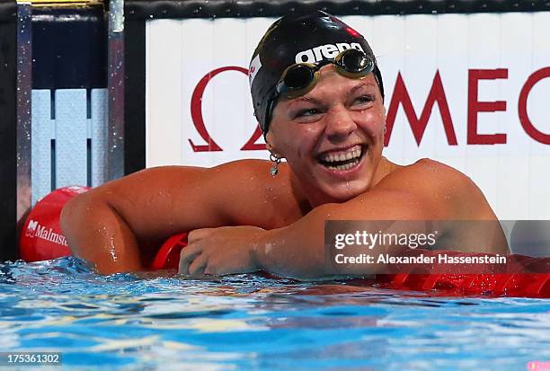 Yuliya Yefimova of Russia celebrates her new world record after the Swimming Women's 50m Breaststroke preliminaries heat eight on day fifteen of the...