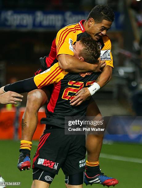 Augustine Pulu congratulates Robbie Robinson on his try during the Super Rugby Final match between the Chiefs and the Brumbies at Waikato Stadium on...