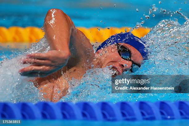 Ryan Cochrane of Canada, Daniel Fogg of Great Britain competes during the Swimming Men's 1500m Freestyle preliminaries heat three on day fifteen of...