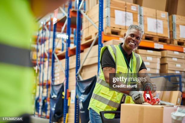warehouse pickers - warehouse worker stock pictures, royalty-free photos & images