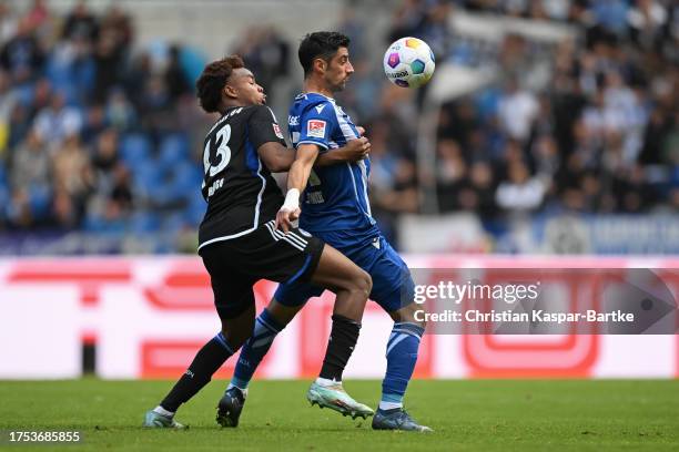 Lars Stindl of Karlsruher SC is tackled by Assan Ouedraogo of FC Schalke 04 during the Second Bundesliga match between Karlsruher SC and FC Schalke...