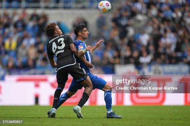 Lars Stindl of Karlsruher SC is tackled by Assan Ouedraogo of FC Schalke 04 during the Second Bundesliga match between Karlsruher SC and FC Schalke...