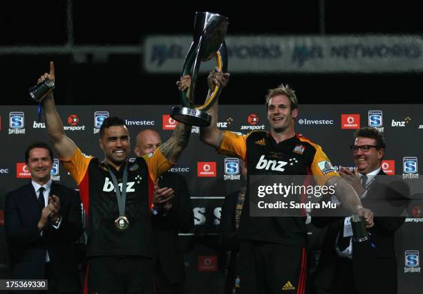 Liam Messam and Craig Clarke of the Chiefs hold the trophy after winning the Super Rugby Final match between the Chiefs and the Brumbies at Waikato...