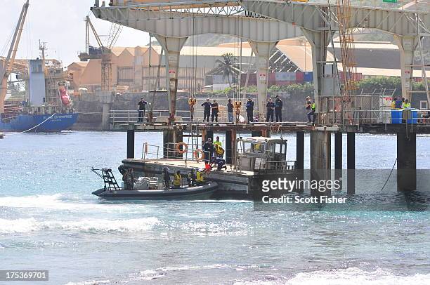 Suspected asylum seekers arrive at to Flying Fish Cove, Christmas Island, after being intercepted and escorted in by the Australian Navy, on August...