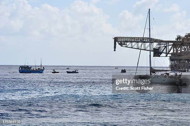 Suspected asylum seekers arrive at to Flying Fish Cove, Christmas Island, after being intercepted and escorted in by the Australian Navy, on August...