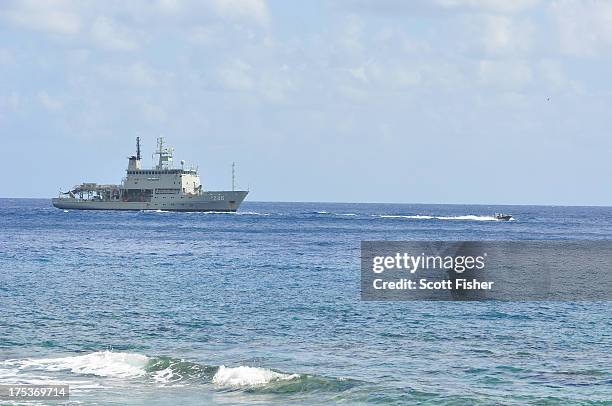 Suspected asylum seekers arrive at to Flying Fish Cove, Christmas Island, after being intercepted and escorted in by the Australian Navy, on August...