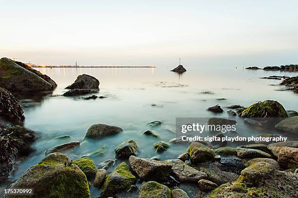 view in the evening from the forty foot - dun laoghaire stock-fotos und bilder