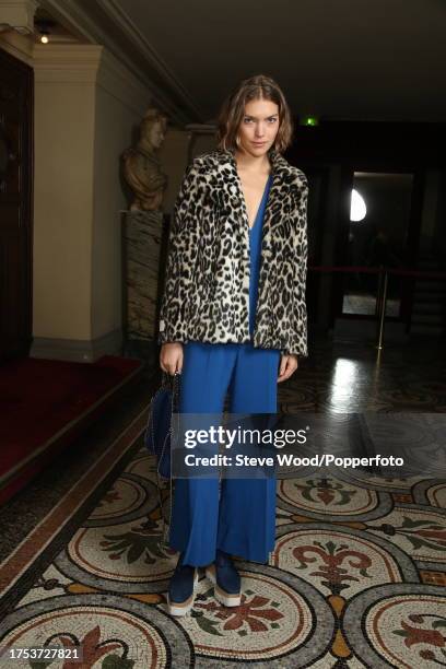 Backstage at the Stella McCartney show during Paris Fashion Week Autumn/Winter 2016/17, model Arizona Muse wears a blue cropped legged jumpsuit with...