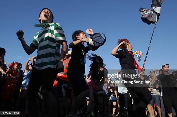 Festival-goers enjoy a performance during day 2 of the Pentaport Rock Festival on August 3, 2013 in Incheon, South Korea.