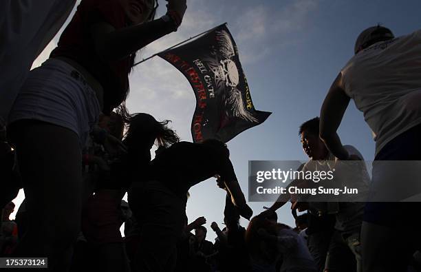 Festival-goers enjoy a performance during day 2 of the Pentaport Rock Festival on August 3, 2013 in Incheon, South Korea.