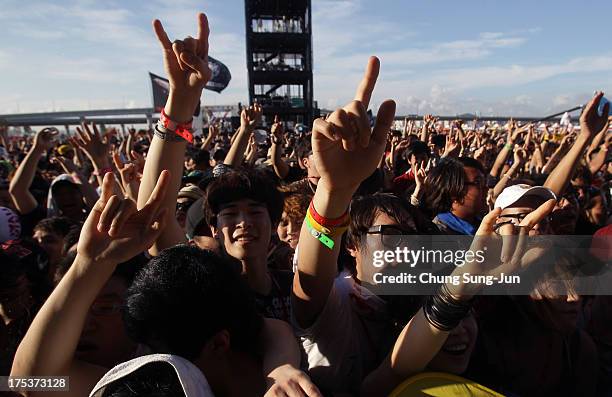 Festival-goers enjoy a performance during day 2 of the Pentaport Rock Festival on August 3, 2013 in Incheon, South Korea.