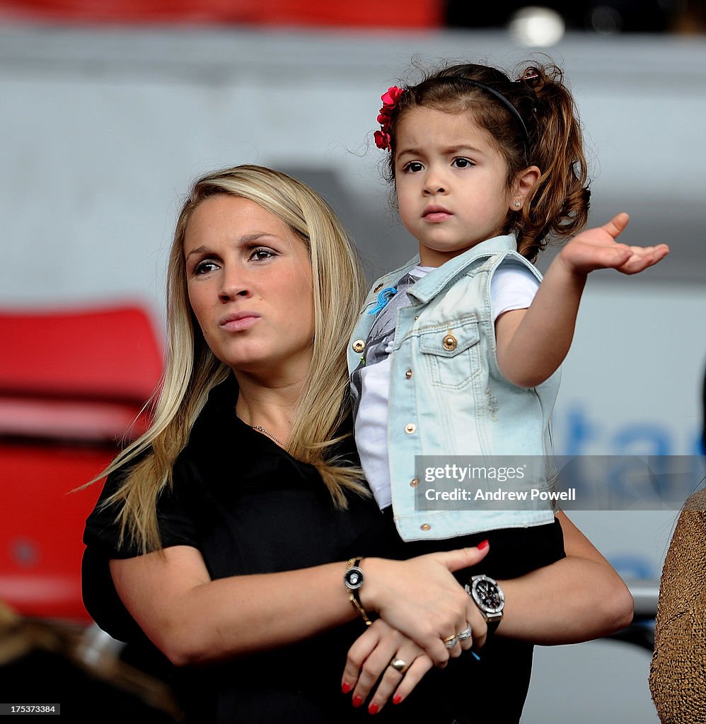 Sofia Balbi, wife of Luis Suarez, with their daughter Delfina in the