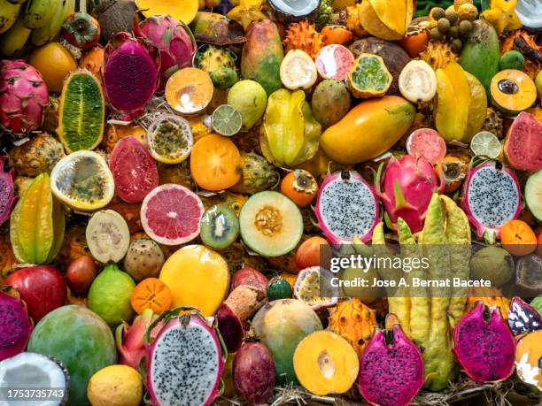 full frame of tropical and exotic fruits in a position of market. - las palmas de gran canaria stock pictures, royalty-free photos & images